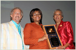 Celebrating her Student Role Model Award with Chioma Umeh (Class of '06, B.S., Biology) are professor of biology Thomas Landefeld and president and CEO of Minority Access, Inc. Andrea D. Mickle (at right).